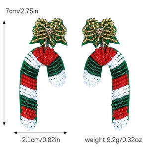 Detail view of handmade beaded candy cane earrings with red and white bow, 7cm height