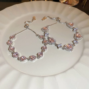Elegant silver heart bracelet with pink and white cubic zirconia crystals