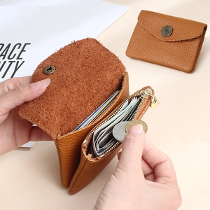 Brown leather daisy snap wallet with lychee texture featuring zipper coin compartment