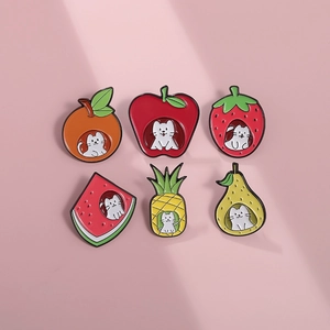 Detail view of six colorful enamel fruit brooches with cute cartoon white cats
