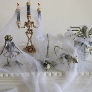 Halloween decor setup with LED skeleton candelabra and animal skeleton prop details