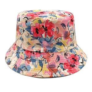Detailed view of colorful abstract floral print and neat stitching on a cotton sun hat