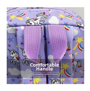 Close-up of durable purple fabric handle and metal zipper on unicorn backpack