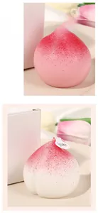Macro shot of realistic peach shaped candle showing detailed frosted texture and wick