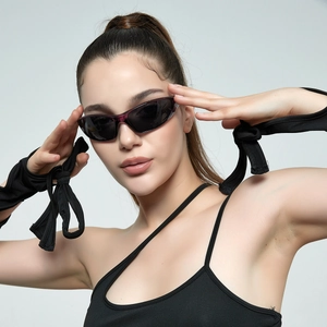 Futuristic silver Y2K sunglasses with semi-transparent red frames and black lenses