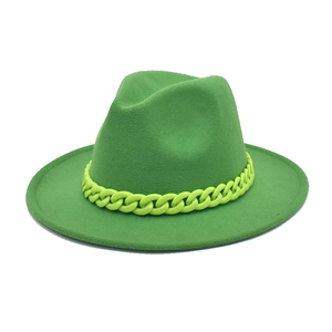 Detail of neon green wool fedora hat with matching chunky acrylic chain link band
