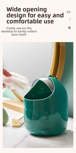 Macro detail of dark green dinosaur mini trash bin featuring wide opening and clear lid