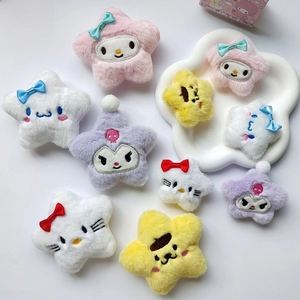 Detailed view of colorful star-shaped plush pins featuring cute embroidered cartoon faces