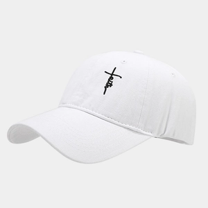 Close-up of white cotton baseball cap with black faith embroidery and 6-panel detail