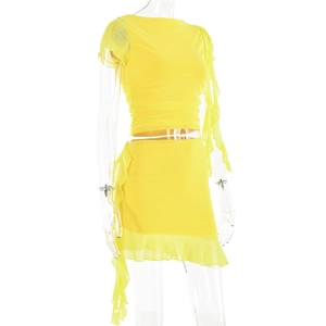Detail view of yellow two-piece set featuring mesh pleated fabric and ruffle hem edges