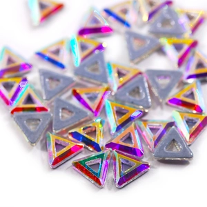 Detailed macro shot of triangular iridescent AB crystals for nail art and DIY jewelry