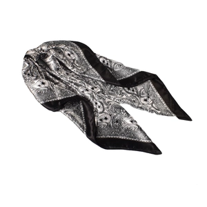 Detail of vintage paisley pattern satin square scarf with elegant black border and silk sheen