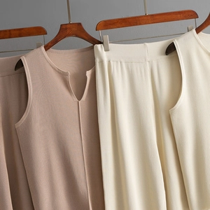 Detailed view of the vertical ribbed knit texture on the sleeveless V-neck vest and pants