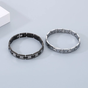 Close-up of black and silver H-link tungsten steel bracelets with professional buckle