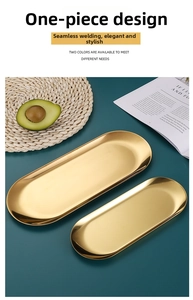 Macro view of gold oval stainless steel trays set with polished metallic finish