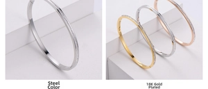Detailed comparison of three zircon-inlaid bangles in steel, gold, and rose gold finishes