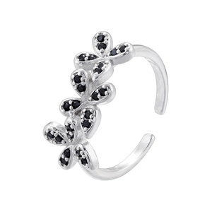 Macro shot of silver bow butterfly ring with black rhinestones on a white background
