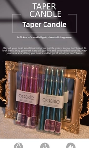 Close-up of 25cm metallic taper candles in a 4-piece gift box with luxury gold decor