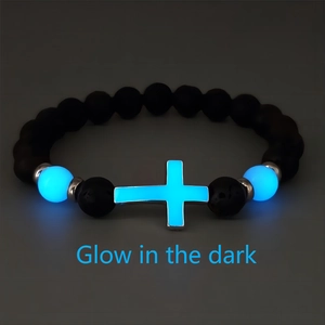 Luminous volcanic stone beaded bracelet with glow-in-the-dark cross and blue beads