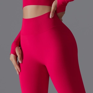 Detailed macro view of thumb hole cuffs and ribbed waistband on seamless yoga set