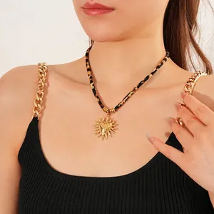 Golden sun heart pendant necklace with trendy leopard print cord on female model