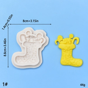 Detail of Christmas stocking silicone mold showing intricate floral and gift patterns