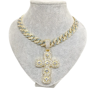 Gold Cuban link necklace with iced out cross pendant featuring blue and clear crystals