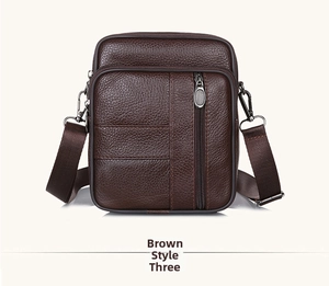 Detailed view of dark brown pebbled leather shoulder bag with multiple zippers