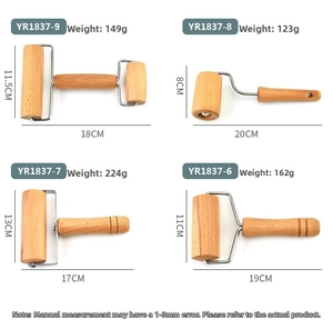 Detail view of beechwood rolling pins with metal brackets for baking and pastry work