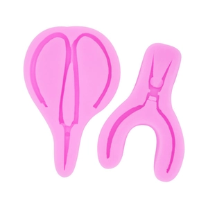 Stampo in silicone rosa con forme di forbici e pinze per decorazioni da forno creative