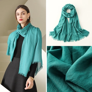 Turquoise thin cotton linen beach scarf with tassels for sun protection and fashion styling