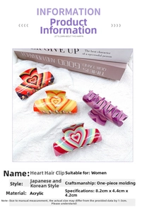 Close-up of four acrylic heart pattern hair claws in vibrant colors for women