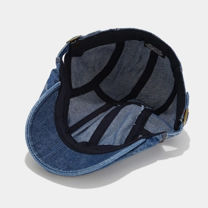 Washed denim beret hat with vintage stitching and bronze buckle in dark blue cotton