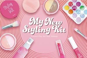 Detail view of pink pretend makeup kit components including brushes and eyeshadow