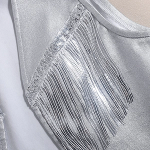 Detailed view of silver sequins and fringe craftsmanship on high-quality PU vest fabric