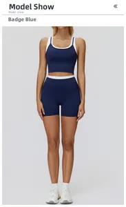 Close-up of Insignia Blue two-piece yoga set with contrasting white trim details