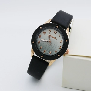 Modern quartz watch with black leather strap and rose gold wavy pattern dial for women