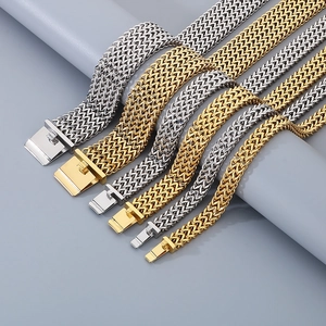 Detail of woven mesh metal bracelets in gold and silver finish with square folding clasps