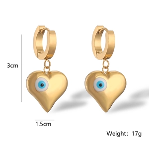 Detailed view of gold heart earrings with evil eye motif showing 3cm length and 17g weight
