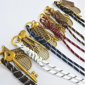 Handmade woven keychains with vintage gold tennis racket and abacus charms in various colors