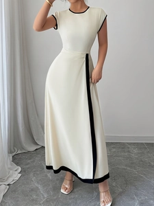 Elegant sleeveless cream long dress with black contrast trim and pleated waist design