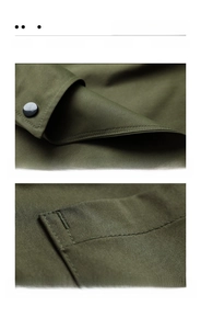 Detailed close-up of double stitching and reinforced pocket on dark olive green canvas apron