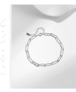 Macro view of S925 sterling silver rectangular geometric link chain with adjustable clasp