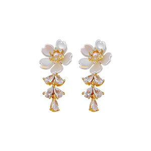 Golden flower earrings with white pearl petals and sparkling zircon tassel drops
