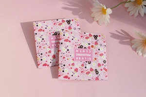 Pink silver polishing cloth in square strawberry pattern packaging for jewelry care