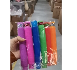 Close-up of 6 colorful glowing pop tubes in purple, pink, blue, green, red and orange
