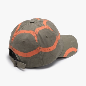 Olive green distressed baseball cap with orange graffiti print and metal buckle