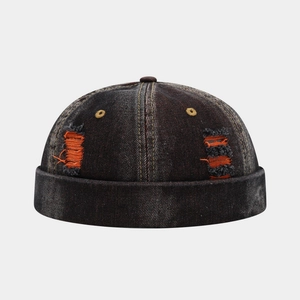 Vintage washed denim docker cap in dark grey with orange distressed ripped hole details
