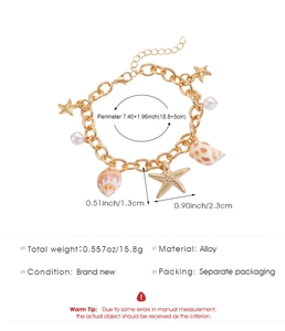 Detail of beach bracelet featuring starfish and shell charms with imitation pearls