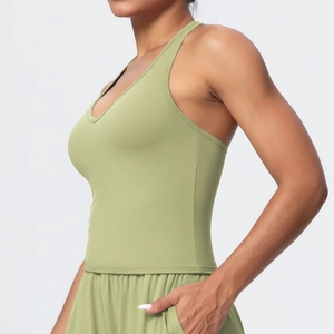 Side view of olive green yoga set showing tight fit top and shorts with side pocket